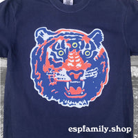 Close-up of navy screen printed T-shirt featuring a large third-eye tiger head design in blue and orange