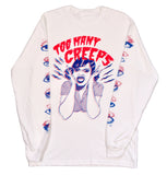 A white long sleeve t-shirt with a graphic print featuring eyes and the text 'Too Many Creeps' on the front.