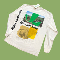Back of white long sleeve shirt with bold green and yellow shapes and collage-style artwork
