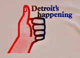 Close-up of vintage-style T-shirt featuring Detroit's Happening text and a red to blue ombre thumbs-up graphic